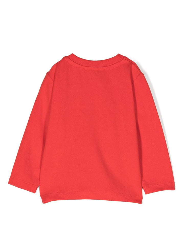 Sweat-shirt rouge coquelicot, imprimé Leo Teddy caractéristique, détail pailleté, col rond, fermeture bouton pression sur l'épaule, manches longues et base droite