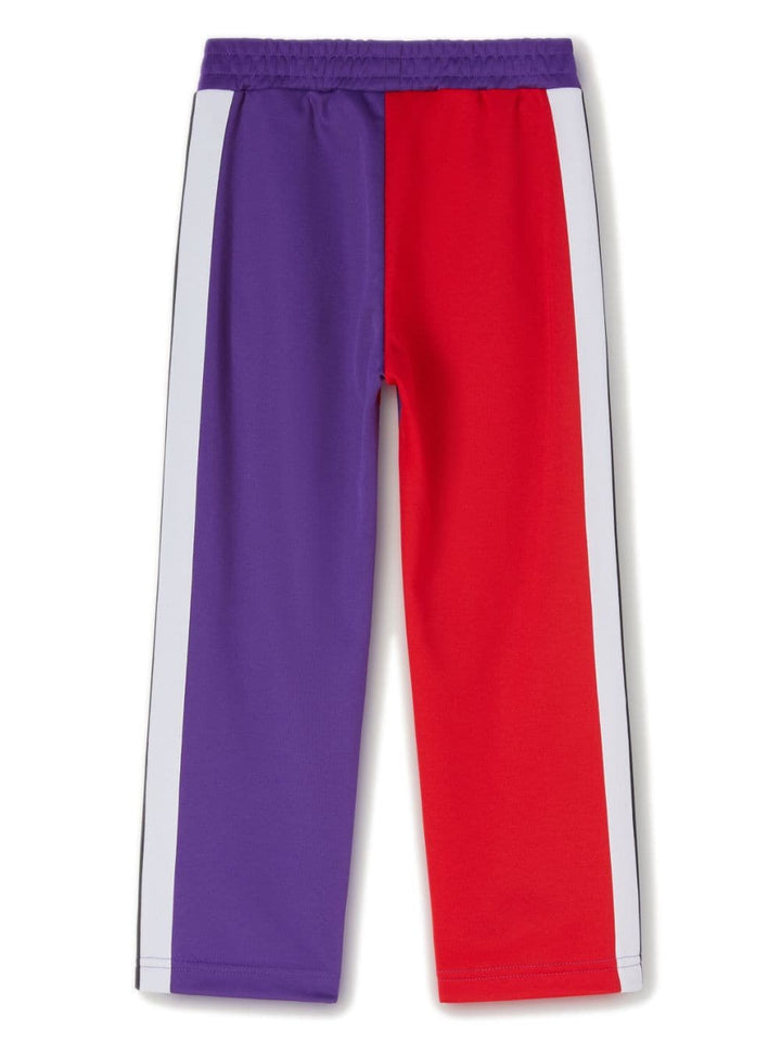 Pantalon enfant violet et rouge avec bandes latérales blanches