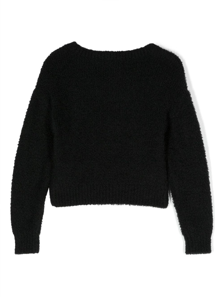 Maglia nera con applicazioni frontali