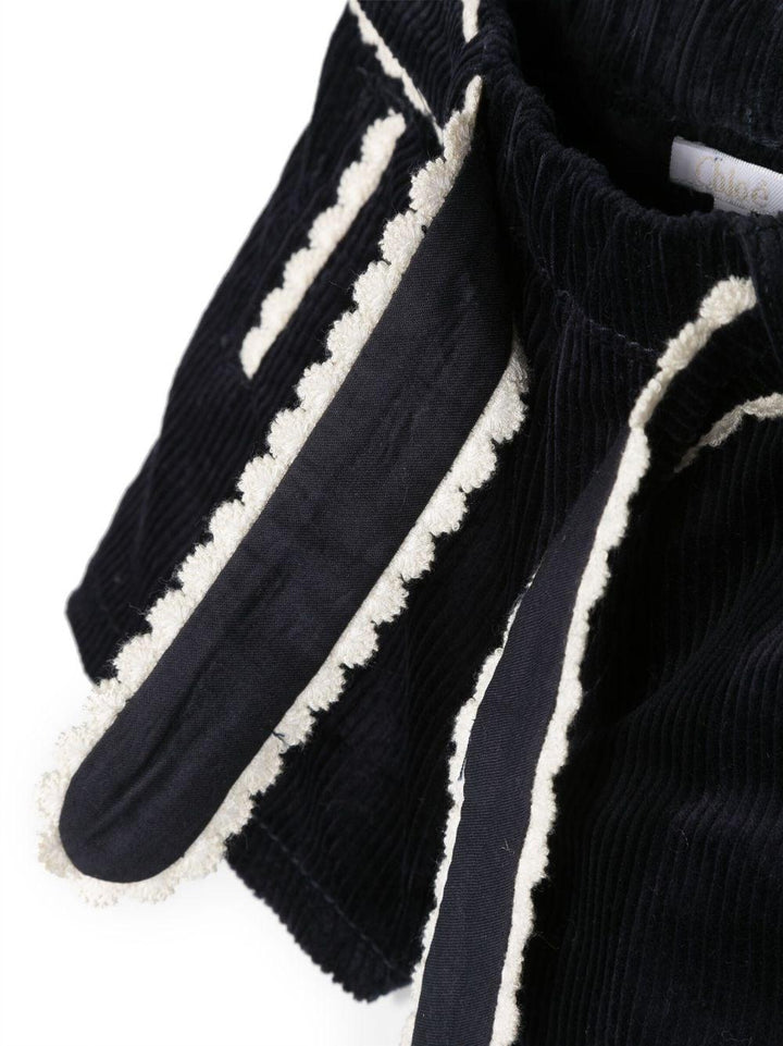 Shorts blu neonata con orlo a smerlo