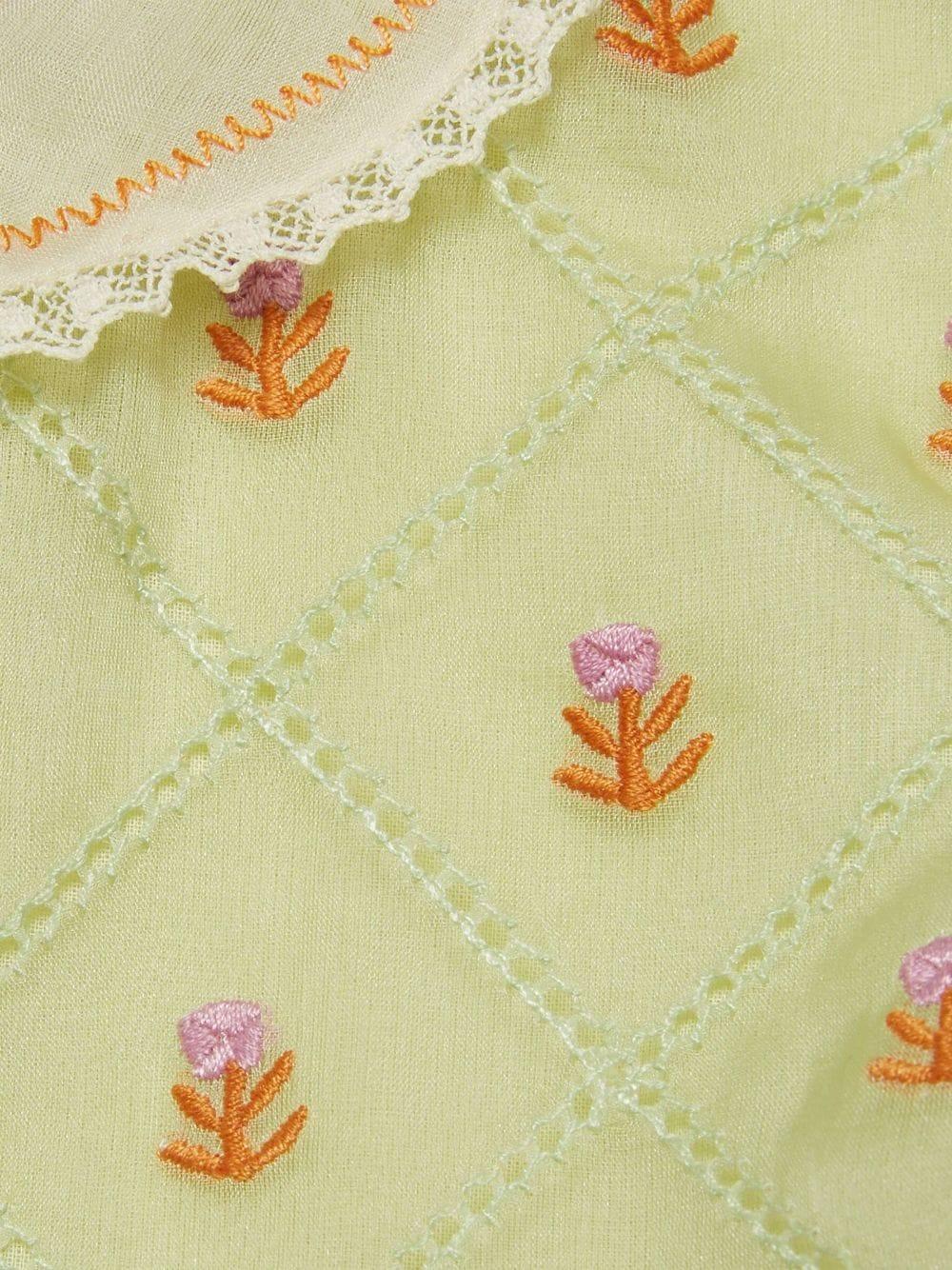 Abito verde bambina in organza con ricami floreali