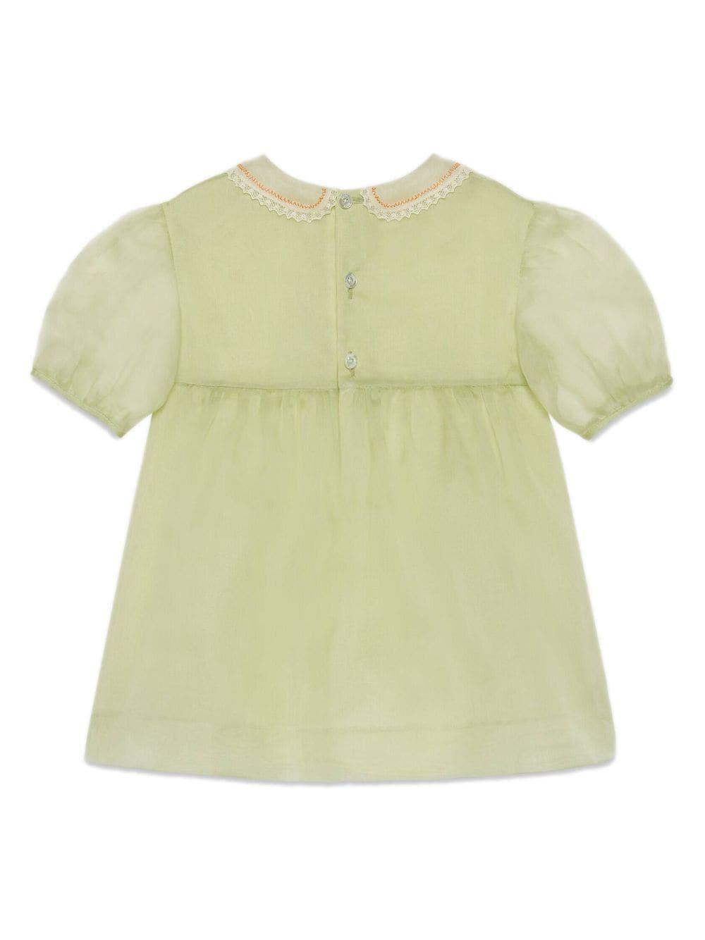 Abito verde bambina in organza con ricami floreali