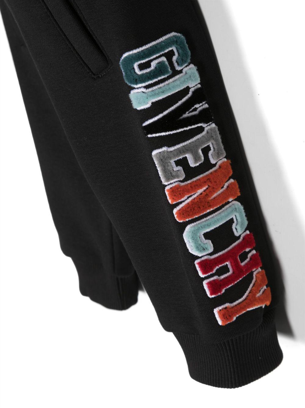 Pantaloni neonato neri con logo bianco