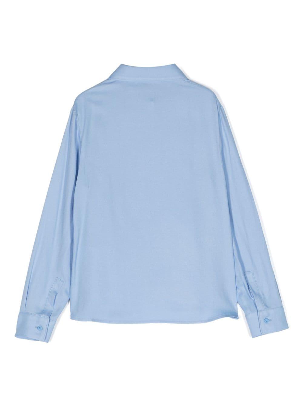Camica azzurra bambina
