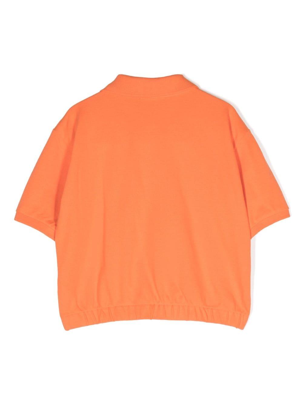 Polo arancione bambina con logo