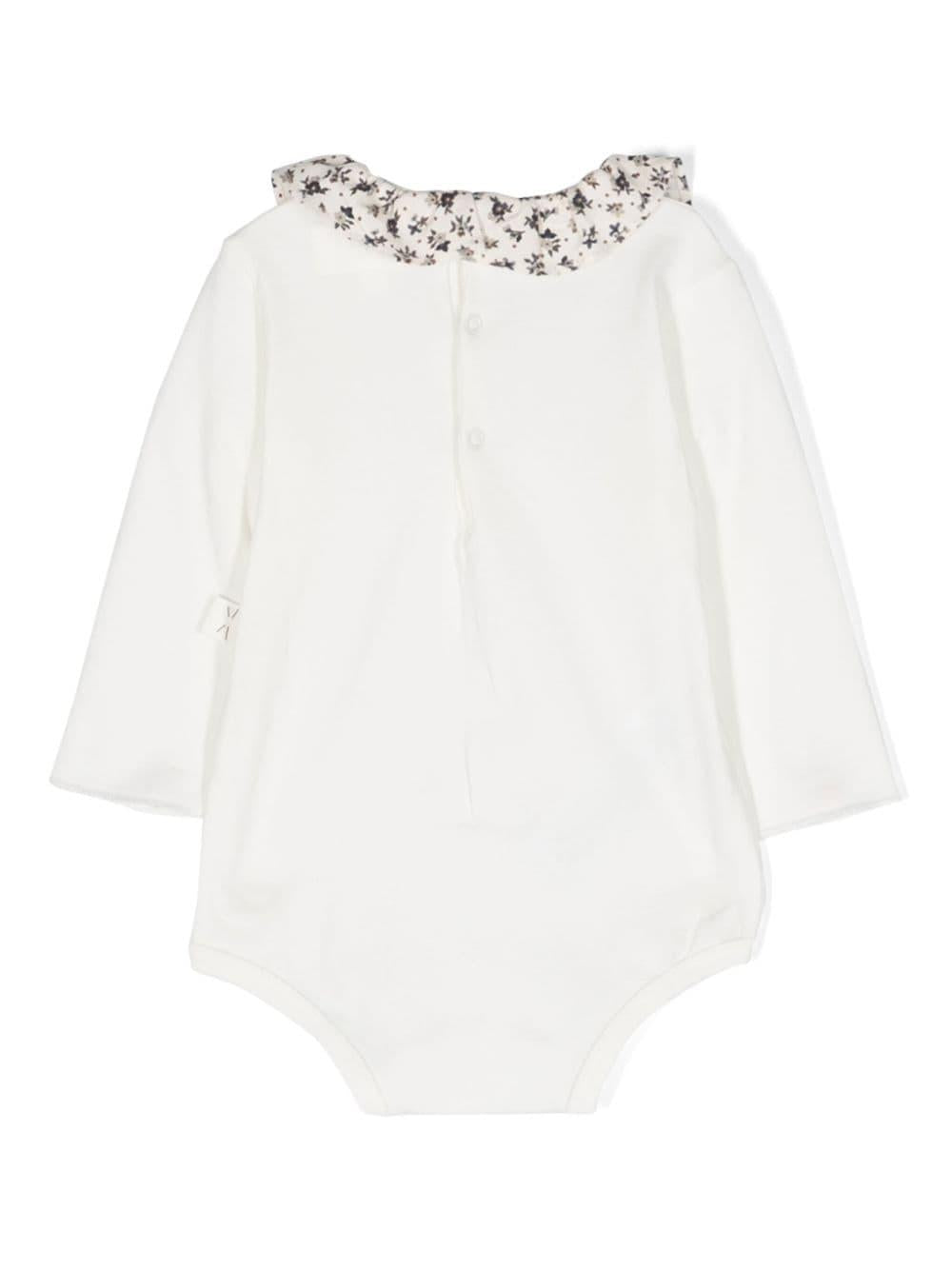 Body bianco neonata con motivo a fiori