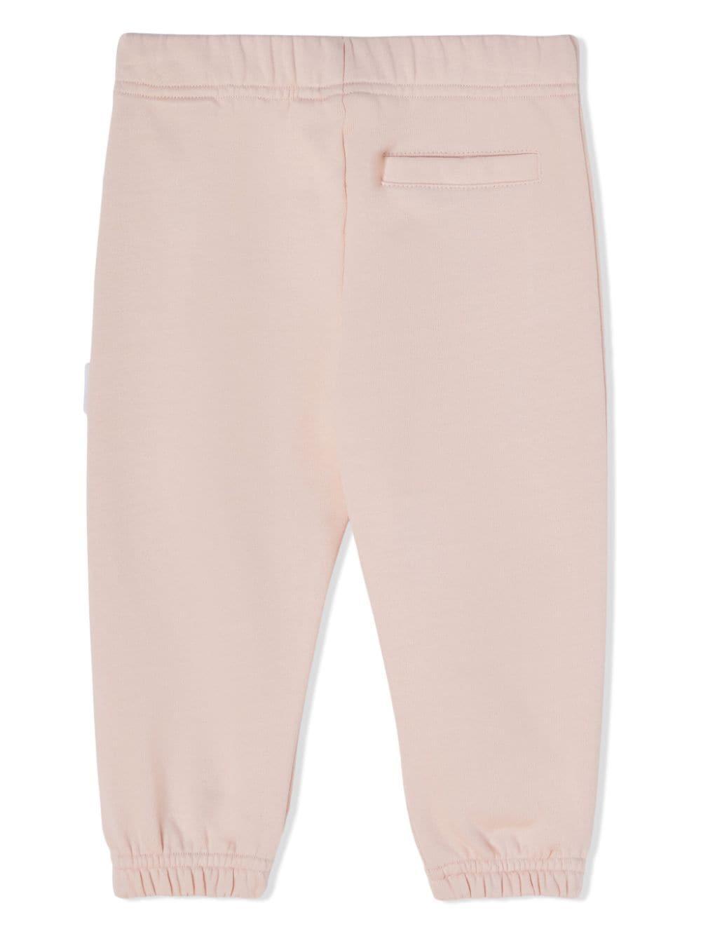 Pantaloni sportivi rosa chiaro neonata con stampa PGXD002F23FLE003 3315 PALM ANGELS KIDS 