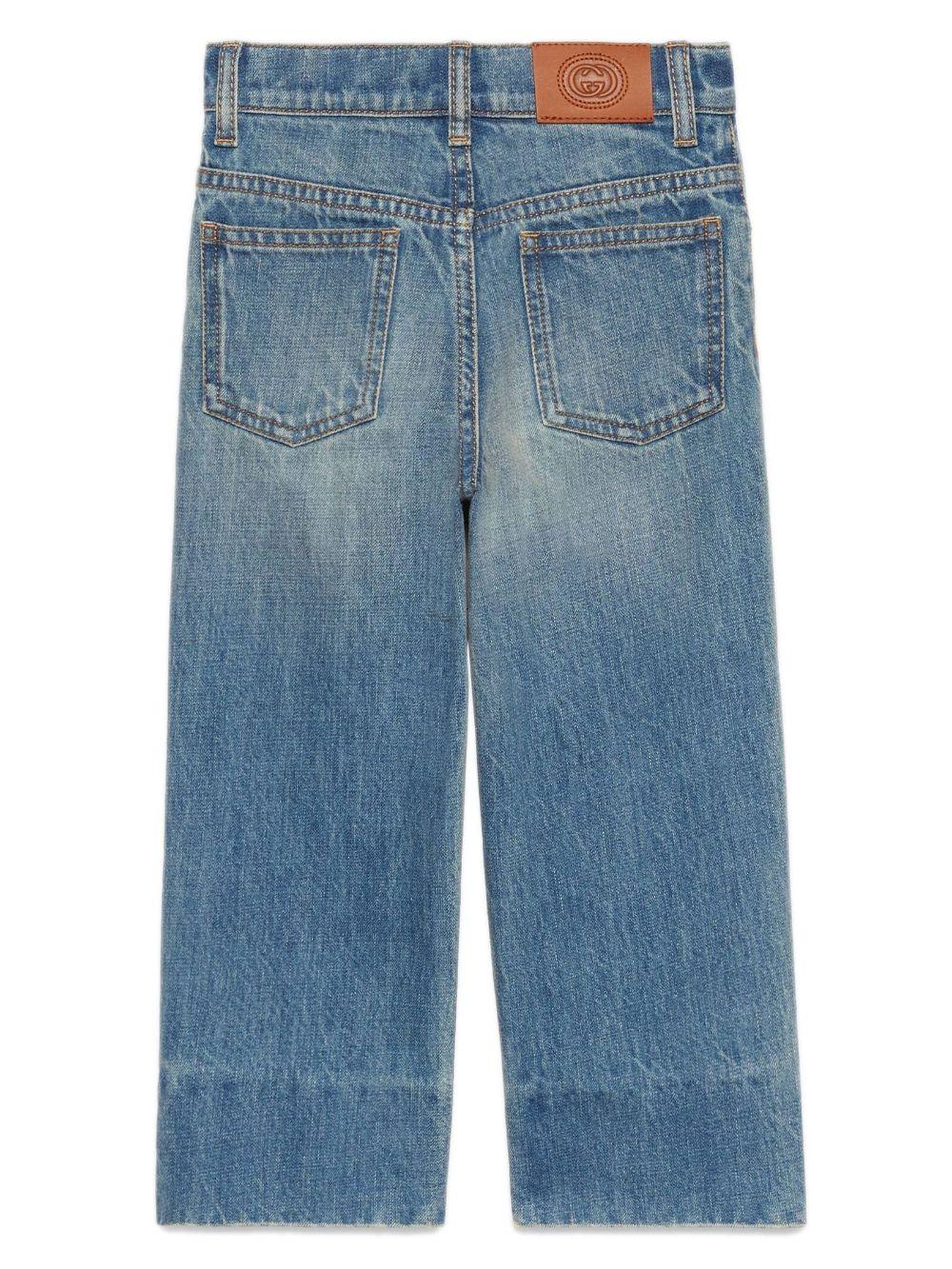 Boy's denim jeans with whisker effect, cotton, bleach wash, whisker effect, logo patch on back, pleated details, signature interlocking G logo, mid rise, straight leg, concealed fly and button fastening, belt loops, classic five pocket and hem straight