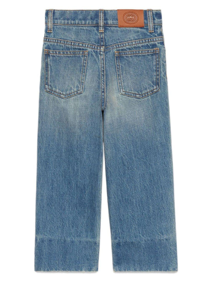 Boy's denim jeans with whisker effect, cotton, bleach wash, whisker effect, logo patch on back, pleated details, signature interlocking G logo, mid rise, straight leg, concealed fly and button fastening, belt loops, classic five pocket and hem straight