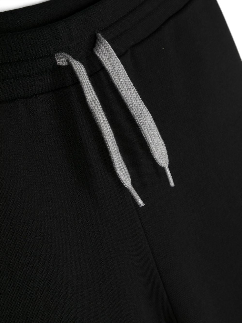 Pantaloni sportivi bambino neri con coulisse bianca