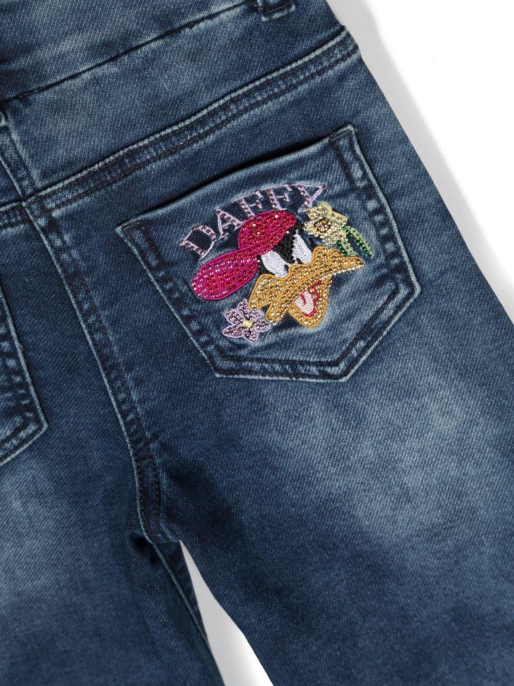 Jeans denim bambina con stampa 'Duffy Duck' posteriore