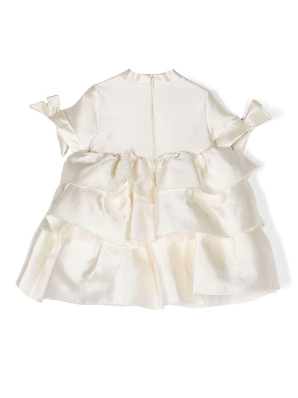 Abito bianco neonata,con fiocco frontale e laterale,dettaglio gonna rouches,chiusura posteriore con zip MGAB067TS0807 CRM MI.MI.SOL 