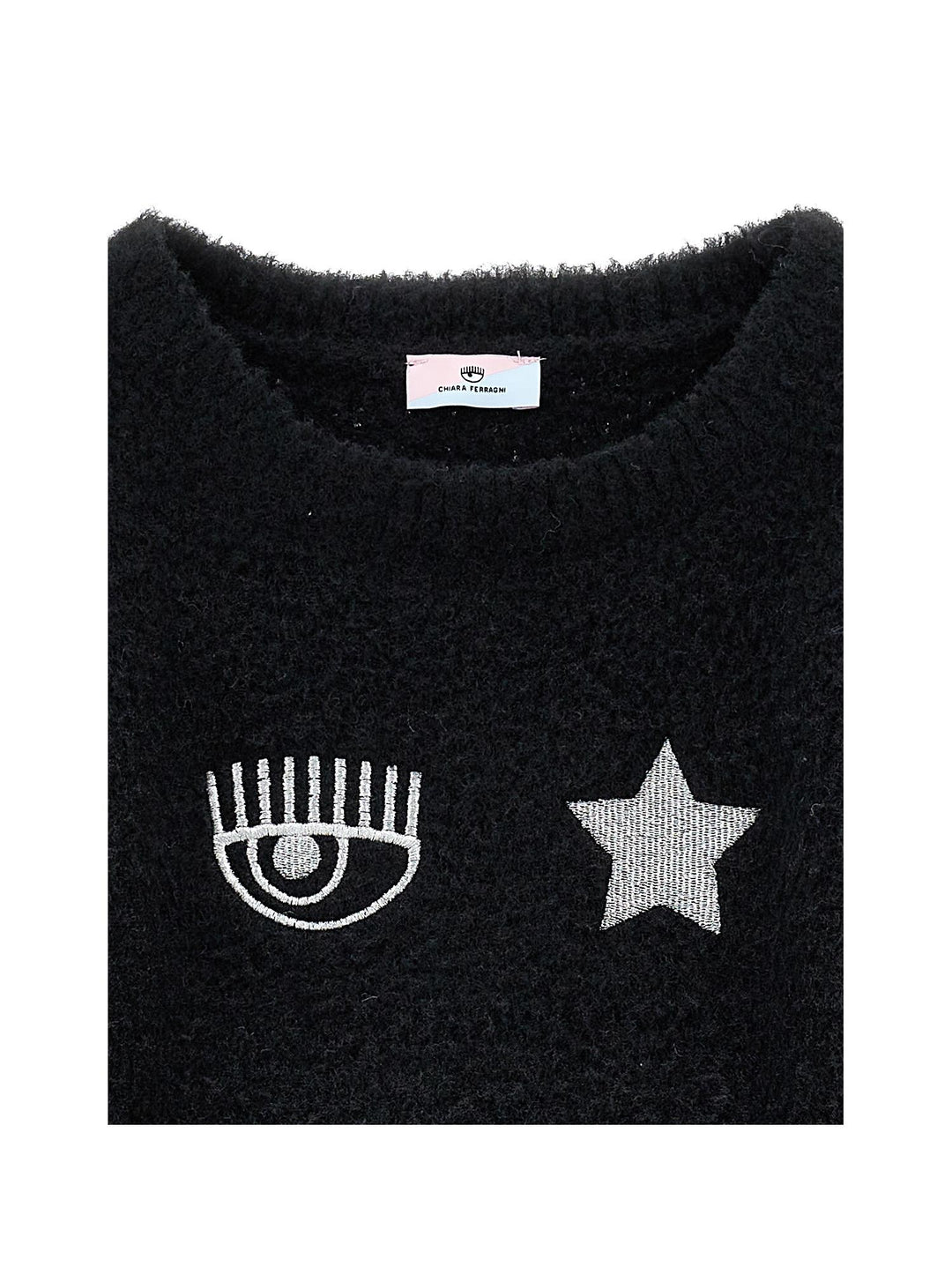 Maglia nera con applicazioni frontali