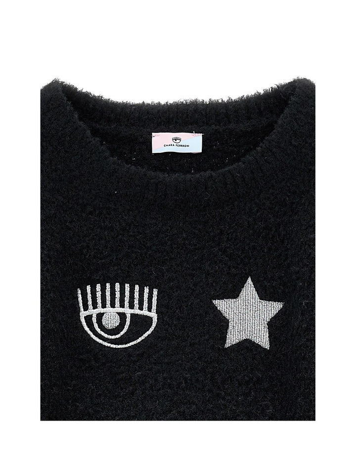Maglia nera con applicazioni frontali