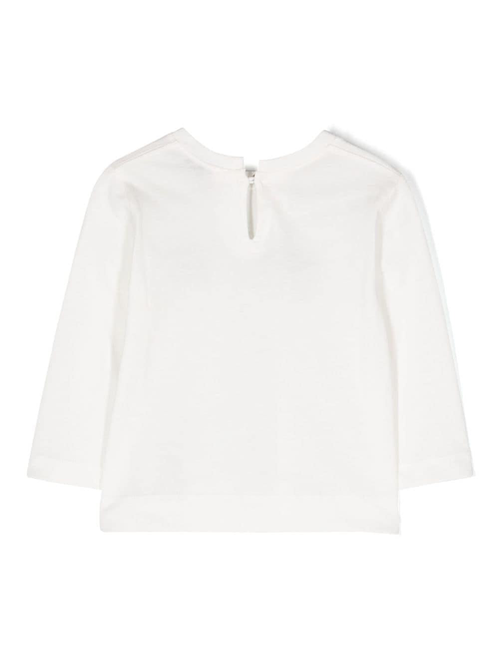 Maglia bianca con applicazioni